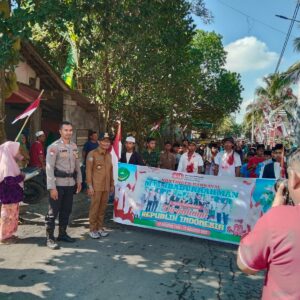 Bhabinkamtibmas Desa Tibusisok Polsek Janapria Kawal Karnaval Meriah di Janapria